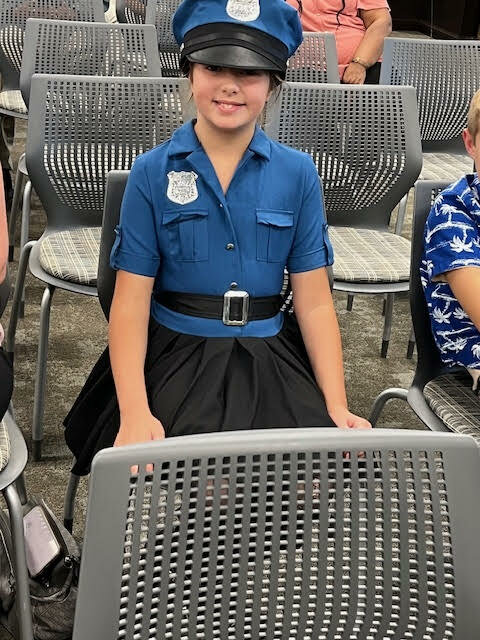 Samantha Gormon, 10, backs the blue during Monday’s meeting of the Walker City Council. She was displaying her support for her mom’s fiancé Matthew Woerner, who was approved as the city police department’s newest full-time patrolman.
