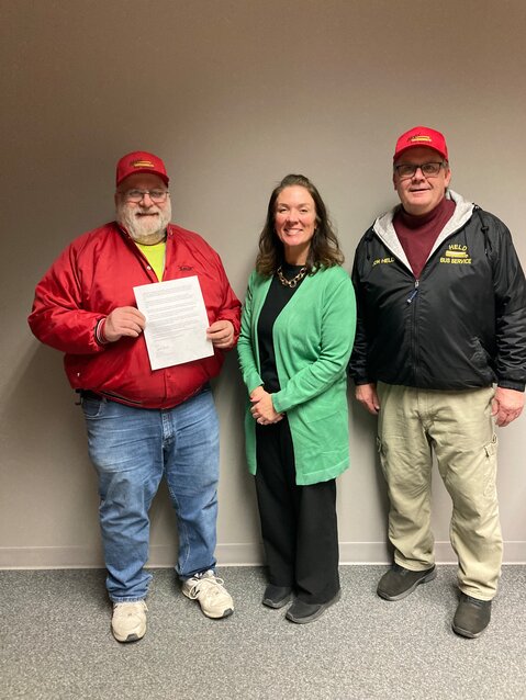 Held Bus Service accepting School Bus Driver Appreciation Day proclamation from Kenyon-Wanamingo Superintendent Beth Giese.
L to R:  Lorin Pohlman, Supt Giese, Jon Held