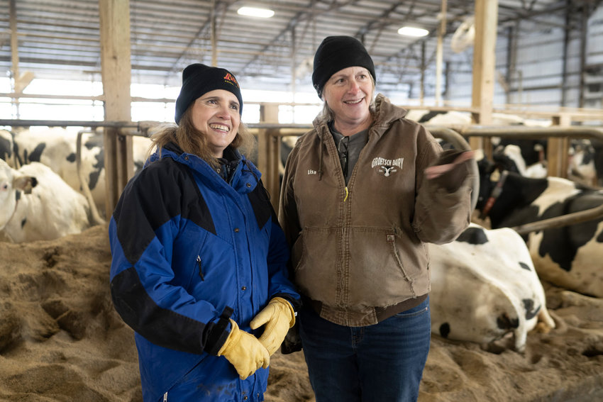 Marcia Endres, U of M Extension animal scientist (left) visits with Lisa Groetsch