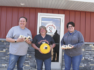 Friends and owners of CannonBelles &ndash; (from left) Jackie Ohmann, Kathy Hupf and Deeann Lufkin &ndash; stand in front of their new cheese plant near Cannon Falls, Minnesota. The new cheese plant became operational May 6.
