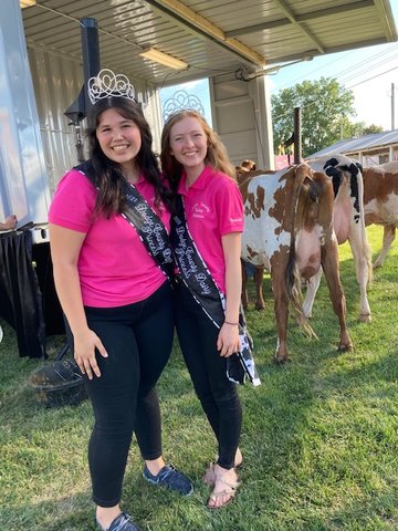 Dodge County dairy princesses Gabby Espinosa, and Amanda Sauder participated in the annual cow milking contest Wednesday.