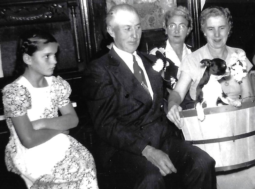 Louie and Doris Wencel (nee Scott) at their 25th wedding anniversary. Karolyn Kleven Raddatz is sitting to the left of Louie.  The Wencels farmed in Concord Township two miles north of West Concord.