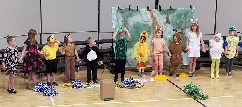 K-2nd grade students presented &quot;The Tortoise and the Hare&quot; during the St. John's School Spring play.  The tortoise, played by Autumn Peters, crossed the finish line ahead of the hare, played by Clara Weckerling.