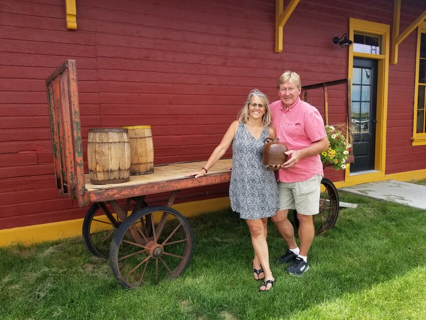 Jeff and Carolyn Ryan, owners of The Goodhue Depot, hold a jug that was unearthed in one piece during the building's restoration.