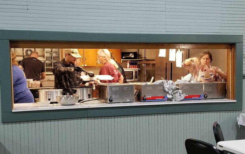 Bellechester Community Center Association members and volunteers package take-out meals and leftovers following the November 3rd fundraising supper.