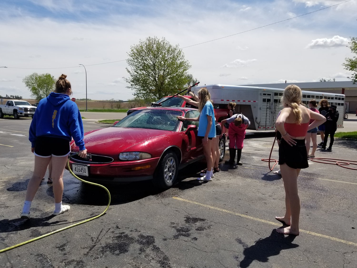 Members of the Goodhue High School National Honor Society came and went as their schedules allowed, helping out at their semi-annual car wash.  A steady line of all types of vehicles kept the crew busy and raised money for the school scholarship fund.  The Spring fund-raising event was held Sunday, May 15th in the parking lot of the ASCS building off of Highway 58.  The group will host another car wash in the Fall on a date to be determined later.