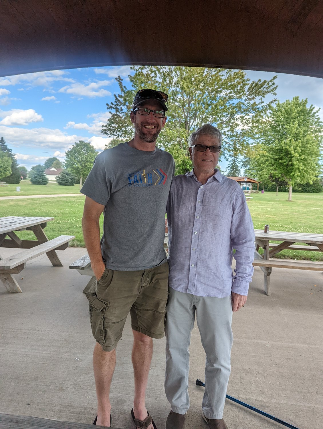 Current pastor, Eric Hanson (L) stands with former pastor, Ron Allen at St. Luke's 125th anniversary celebration held at Rosie Park July 24th.