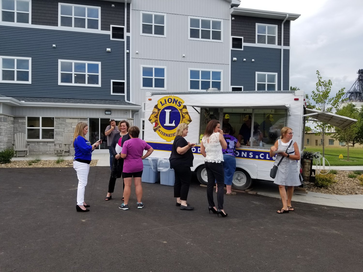 The Goodhue Lion's served food outside the new Goodhue Living facility. A large number of people took advantage of the Red Carpet event held on July 26th.