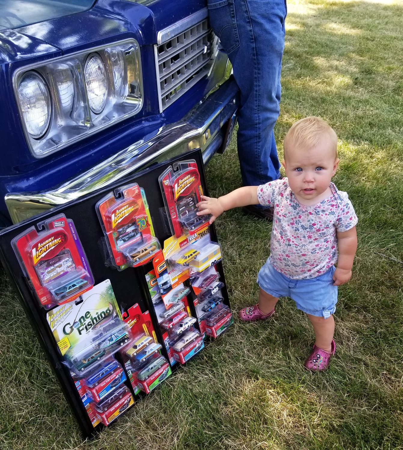 People of all ages enjoyed Clam-Fest including Elsie Roemhildt of Waseca shown here looking at some toy versions of the iconic station wagon.