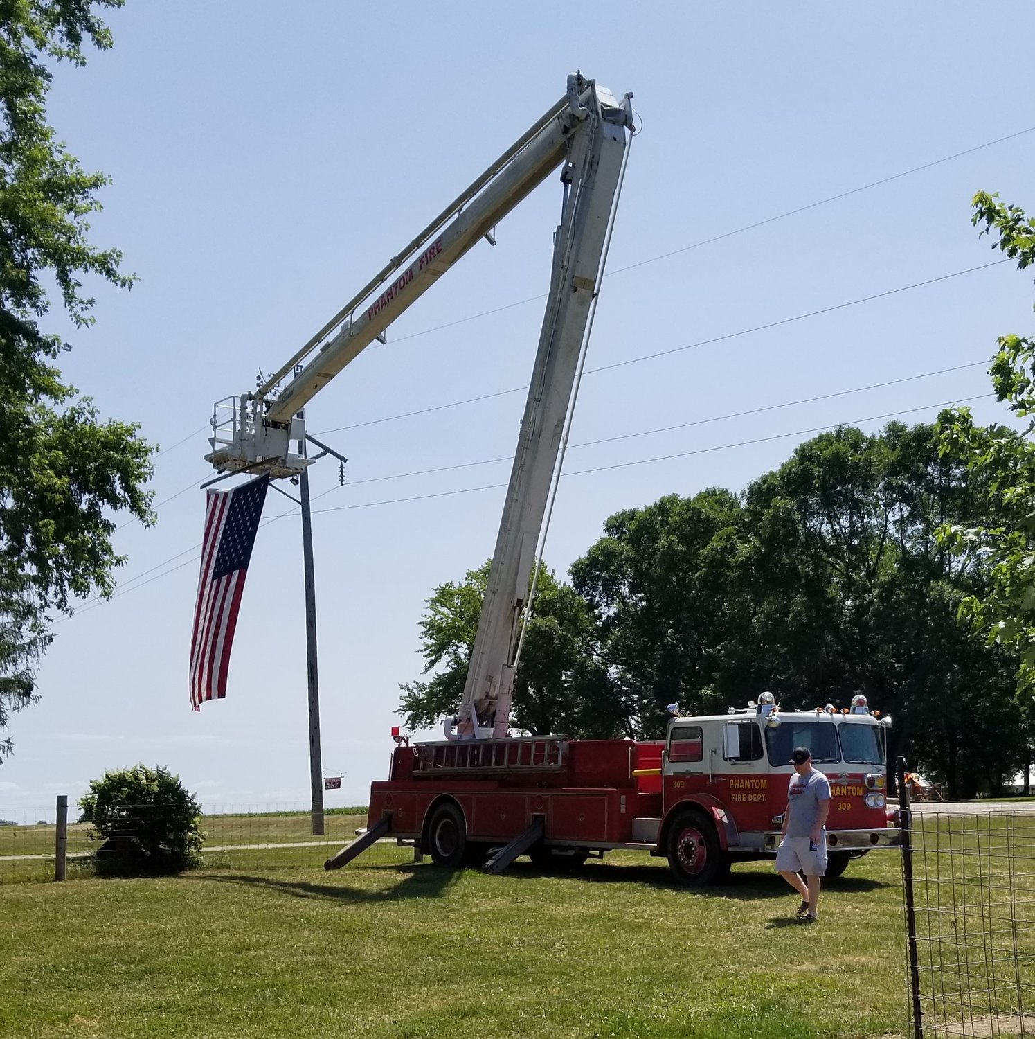 A giant flag hung from the Phantom 309 fire engine welcomed Clam-Fest guests to the Hilbert Strusz farm West of Goodhue on July 30th and 31st.