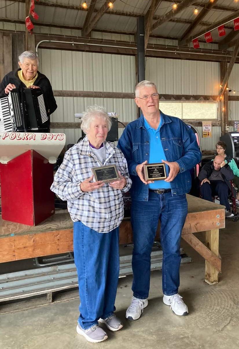 Kay Gadient of Goodhue received the 2022 Female Outstanding Volunteer Award presented at the Goodhue County Fair on August 11th which was also proclaimed "Ray Sands Day".  Ray Sands and the Polka Dots entertain fair-goers yearly and played for Bill and Kay's wedding dance in 1954.  Howard Ayen of Zumbrota was honored with the Male Outstanding Volunteer award.