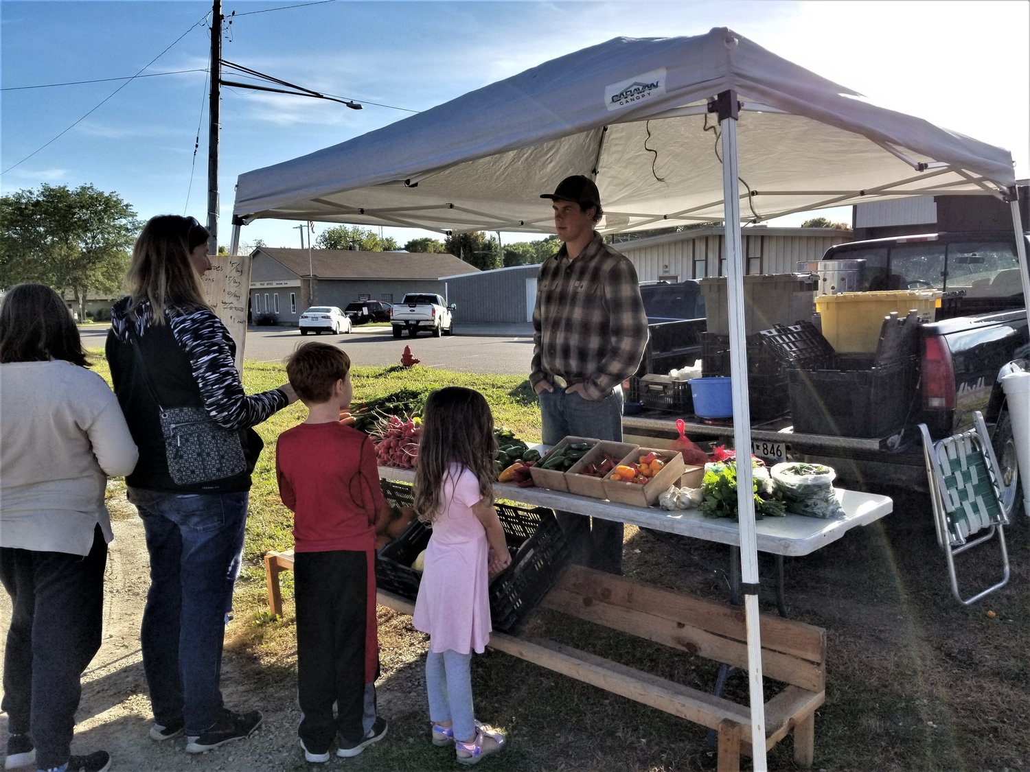 Chase Jacobson waits on customers at a recent Goodhue Farmer’s Market.  Chase is a regular vendor who brings fresh vegetables from his farm near Sogn.  Although some things are sold out for the season, he still offers a great variety.  Find him on Facebook at CJ Farms. 