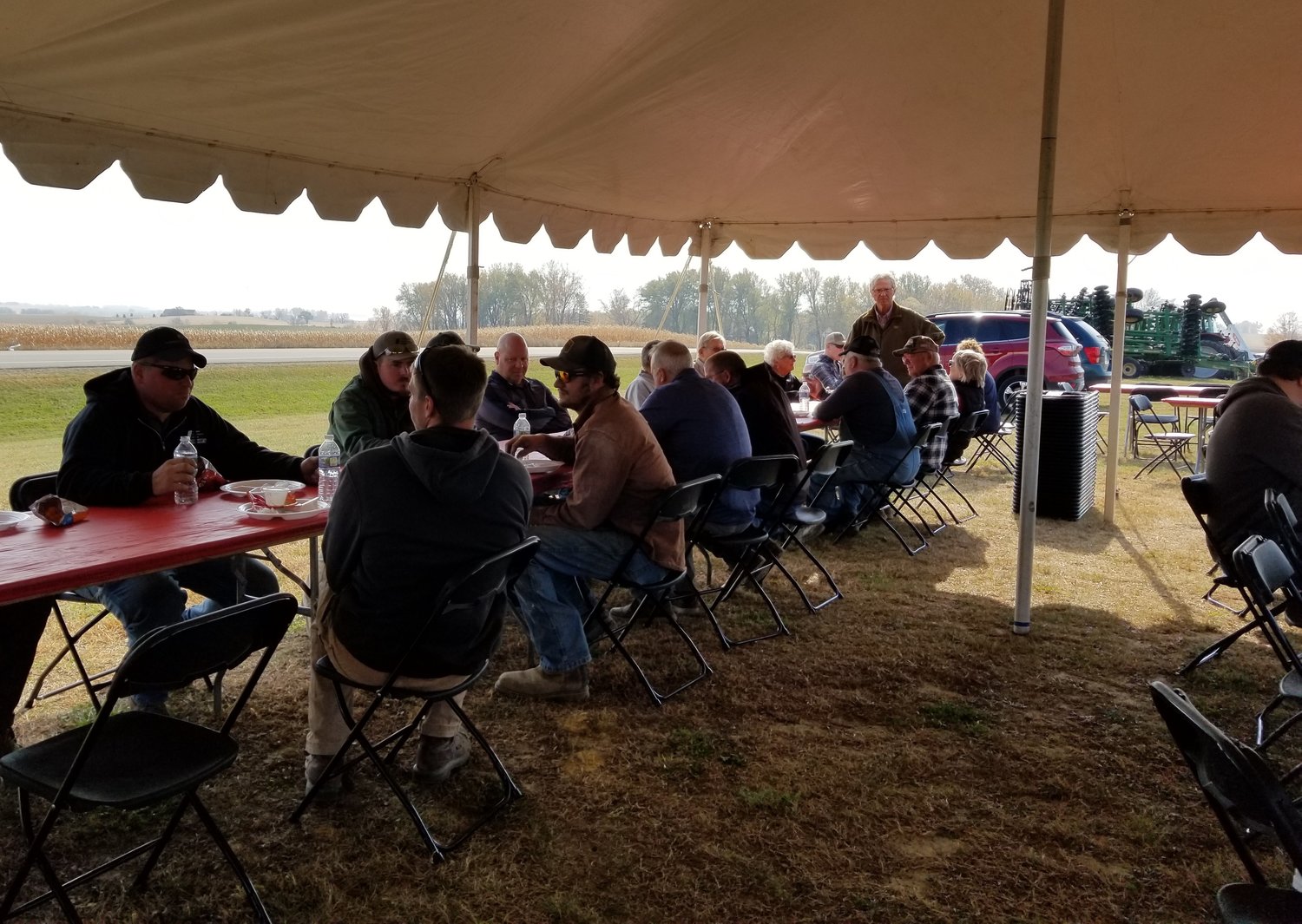 A group of area farmers and residents enjoyed lunch and conversation under the tent at Lodermeier’s during KCUE radio’s annual Harvest Lunch held October 21st. 