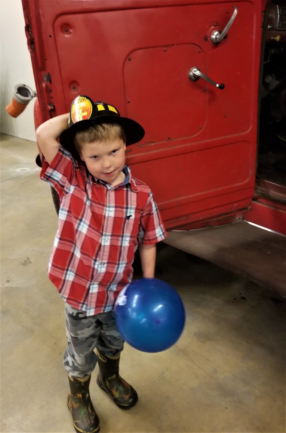Evan Weckerling, son of Goodhue Fire Chief Derek Weckerling, enjoyed hanging out at the fire hall during the open house fund raising event on October 16th. 