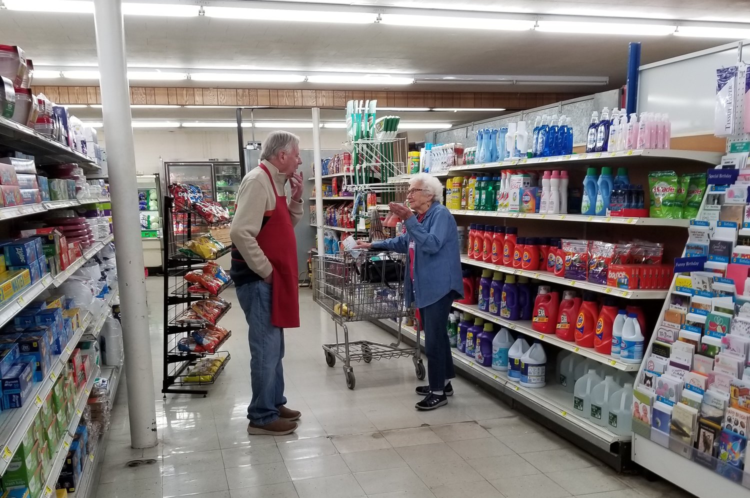 Don Schulte takes a minute to visit with Alice Mehrkens, one of the many customers that came to wish him well on his 75th birthday and retirement.