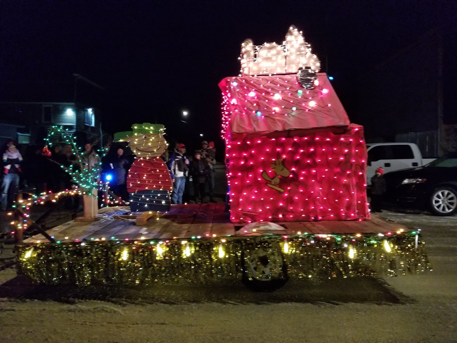 The winning entry in the 2nd annual Bellechester lighted parade was Charlie Brown, Snoopy, and his doghouse created by Nick and Kim Keller from scrap materials.
