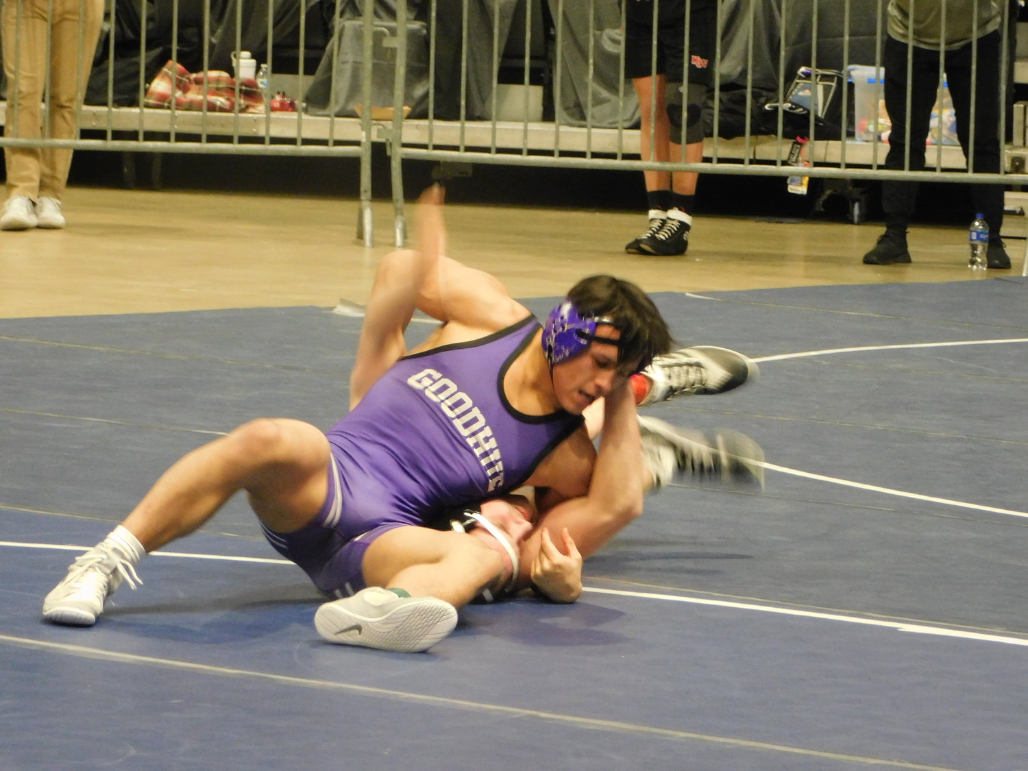 Grant Reed wrestling through a position over the Fillmore Central Opponent