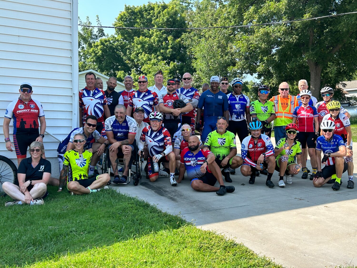 Group at Bellechester Community Center, includes HERO riders and Bellechester American Legion members.