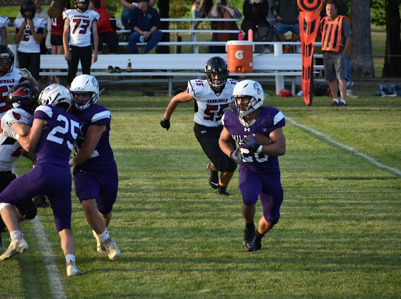 Grant Reed running the ball for the Wildcats