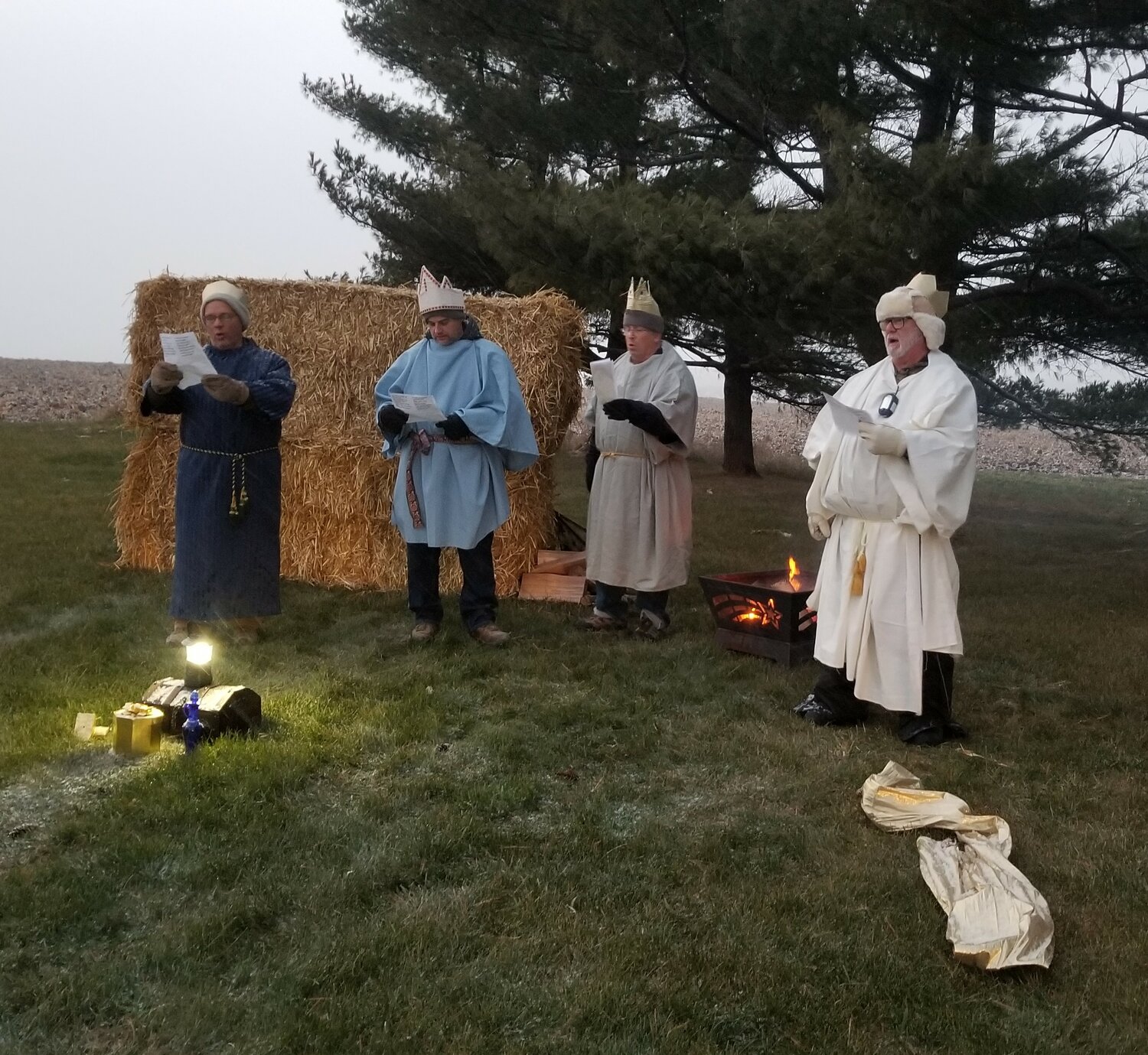 Church volunteers at each station sang Christmas carols as visitors’ vehicles slowly drove past.  This group of wise men are (l-r): Pastor Robbin Robbert, Jed Post, Joel Pankow and Dean Tiedemann.