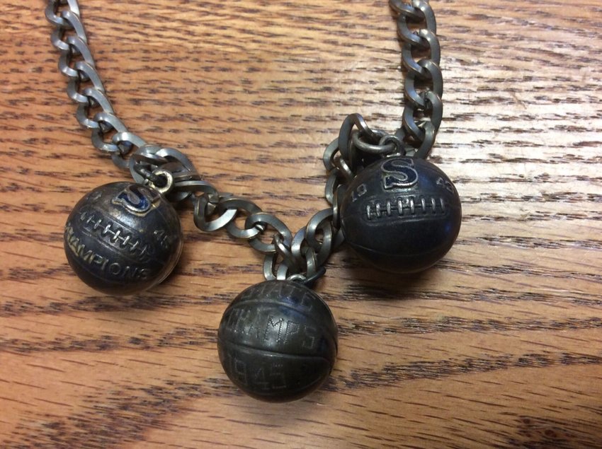 The Missouri state basketball state championship chain is still in excellent condition considering its age. Details on each basketball charm can be seen clearly, commemorating Conway High School&rsquo;s second place appearance in the 1943 state tournament and the Bear&rsquo;s first place win in 1945.