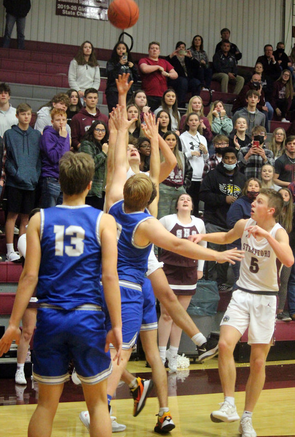 Strafford junior Seth Soden hits a game-tying shot over two Marshfield players at the end of regulation, helping the Indians to a win over the Jays Friday night.