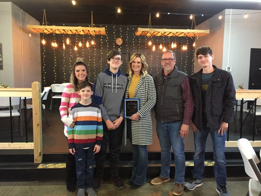 Melanie Fraker, pictured with her family, received the 2020 Pinnacle Award for her service to the community.