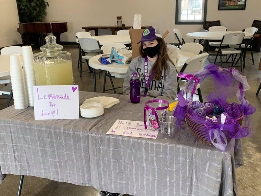 Anzli McNew strives to earn her last badge to achieve her Epilepsy Foundation&rsquo;s Kids Crew World Changer award through a fundraiser, Lemonade For Livy, on Friday at the Thyme to Loaf Bakery in Rogersville.