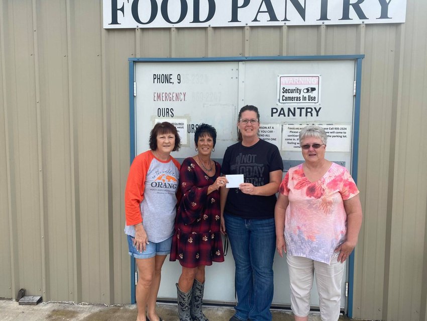 Left to right: Terry Penner, Teri Meyers, Wynona Owens and Genita Kastning presenting a $1,000 check from the Salvation Army to the Seymour food pantry. The Salvation Army donated the same amount to each of the other food pantries in Webster County.