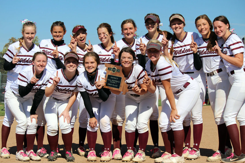 Logan-Rogersville players pose with the first-place district trophy after Saturday afternoon&rsquo;s 16-1 victory over Seneca.&nbsp;