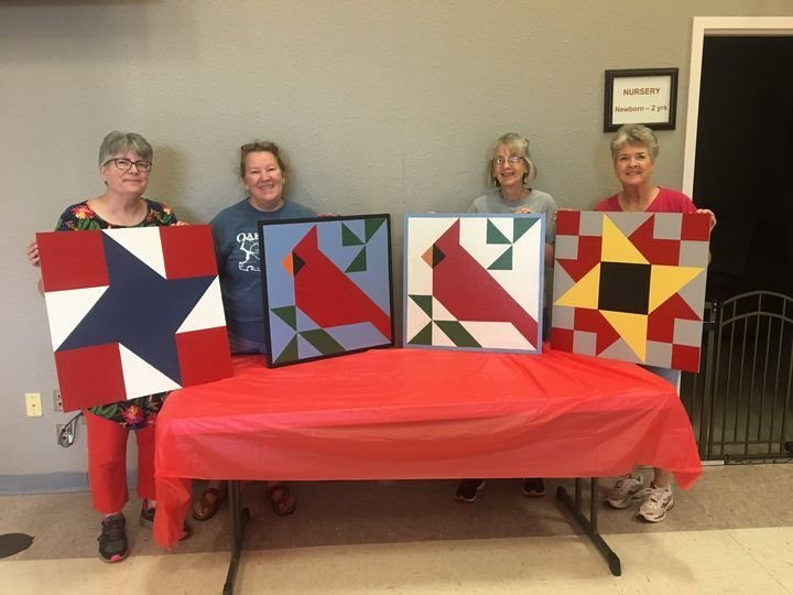 Proud quilters show off the fruits of their labor in the MU Extension Center&rsquo;s barn quilt class. A wide variety of barn quilts will be available for viewing at the Ellis O. Jackson exhibit building at the Webster County Fair.&nbsp;