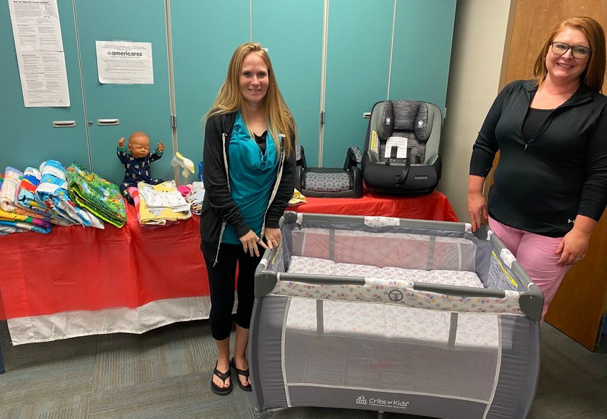 Kayla Cummins (left) and Candace Minton (right) of the Webster County Health Unit assist with programs designed to help eliminate basic health care needs of infants and their families.&nbsp;