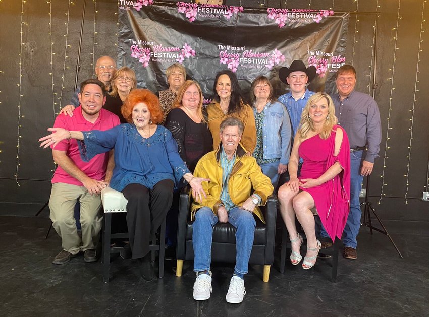 The Cherry Blossom Festival board gathered for a photo op with the &ldquo;Concert for a Cause&rdquo; crew, including Lulu Roman, Randy Travis and Rhonda Vincent.