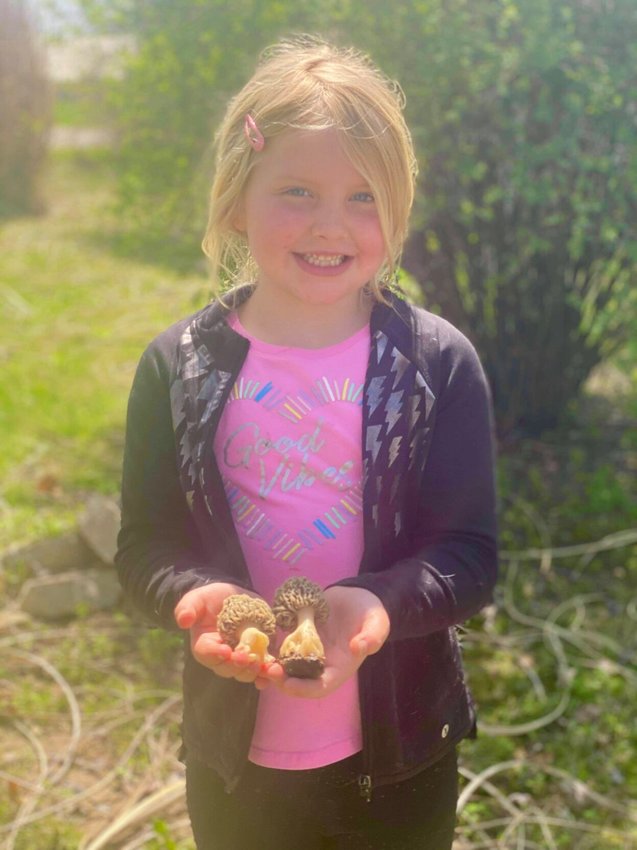 Remi Lowery holds a few of her biggest front-yard finds on Monday, April 13 in Marshfield.&nbsp;