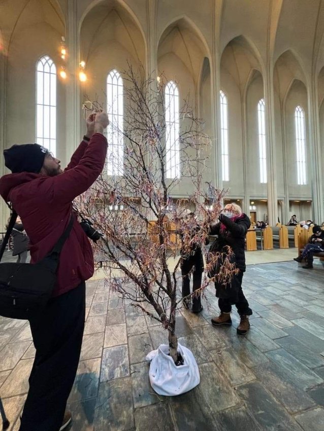People tie ribbons onto the the prayer tree at the Hallsgrimskirkja Cathedral in Reykjavik, Iceland. Hyde visited the cathedral during her March trip to Iceland. &ldquo;It brought me to tears. Seeing people from all over the world inside this amazing cathedral and then to see them praying and tying ribbons on the tree&hellip;it was very moving,&rdquo; reflected Hyde.