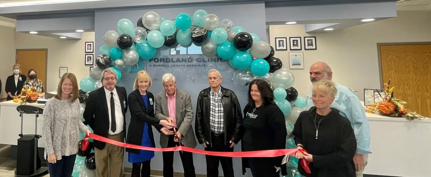 Local community leaders and Fordland Clinic board members and staff during the ribbon cutting on Nov. 11.&nbsp;