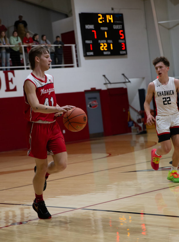 Pictured here going down the court for the Niangua Cardinals is Junior Clayton Henderson.   Contributed Photos by In My Heart Photography.
