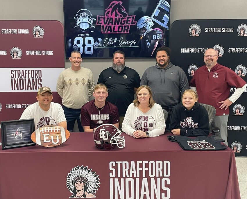 Smiling with pride around family and coaches is Elliot Goings pictured after signing on with Evangel University to play football.   Contributed Photos by Brett Bough.