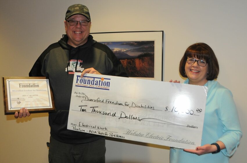 J. P. Sell from Diversified Freedom for Disabilities is pictured here with Denise. The organization received a $10,000 grant to build an Education Pavilion, concrete pads for 6 ADA Porta Potties, power to Education Pavilion, Flagpole, and Activity Building.