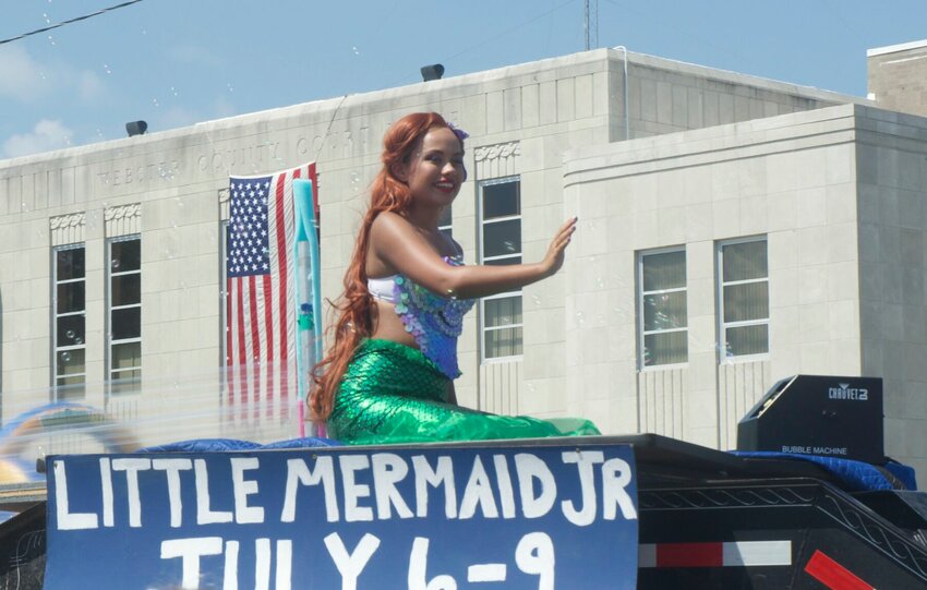 Greeting the crowd at the Marshfield Parade is Tacori Cobile who will be playing as Ariel in MCT's presentation of Disney's &quot;The Little Mermaid, Jr.&quot; July 6-9. The show will be held at Strafford&rsquo;s High School Auditorium, 201 W. McCabe St., Strafford.   Reserved seating tickets are $12 for adults and $6 for youth (ages 17 and under) at marshfieldtheatre.org, plus Eventbrite processing fees. Tickets purchased at the door are $15 for adults and $7.50 for youth.   Mail Photo by Ryder Berger