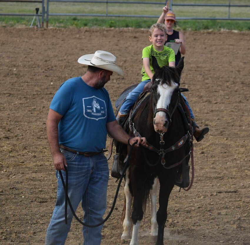 Cade Hampton rides at the July Fun Show hosted by the Marshfield Saddle Club, led by his father Travis Hampton.   Contributed photos by Hellen Newman, Handpict