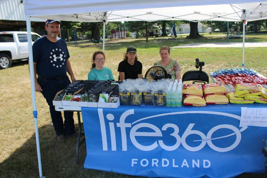 Pastor Arron Caswell was with his daughter Charity, son Romie, and wife Elizabeth from Life 360 Fordland. They attended the parade with a table set giving free snacks, water, and necessities such as chargers and seeds.   Mail Photos by J.T. Jones