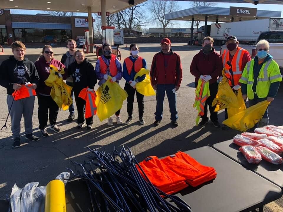A few of the early bird citizens ready to start cleaning up Rogersville with their reflective safety vests, trash pickers, gloves and bags.