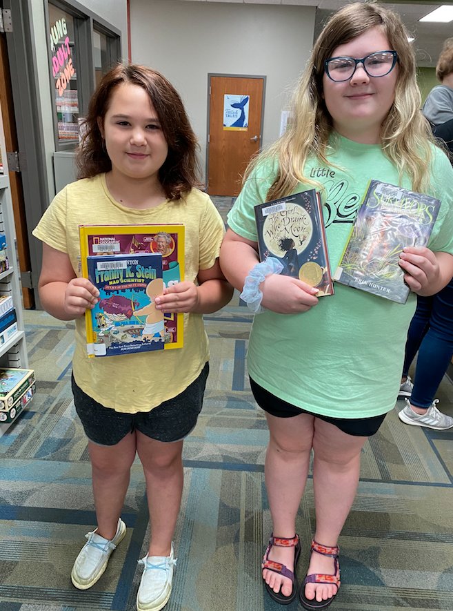 Soon-to-be 3rd grader Charley and her sister, 6th grader Ruby Mitchell, of Conway, love visiting the local Webster County library and recently renewed their library cards for the summer.