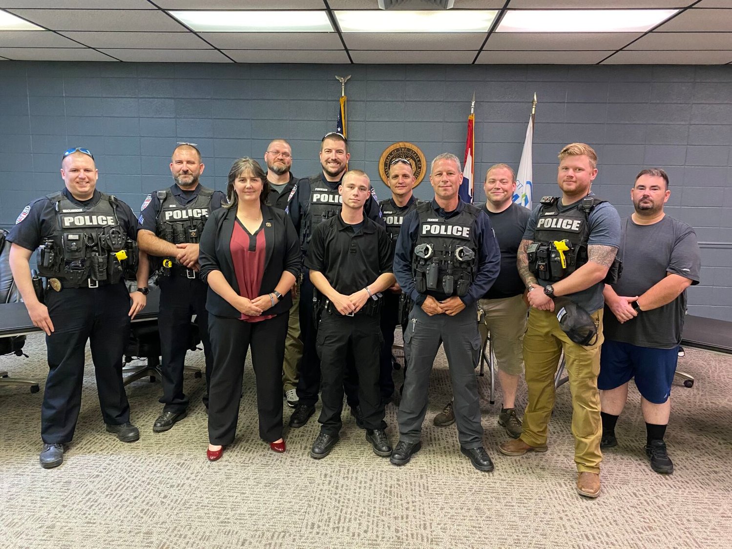 Pictured are members of the Marshfield Police Department including (front left to right) Mayor Natalie McNish, new officer Garrett Fannen and Chief Doug Fannen.