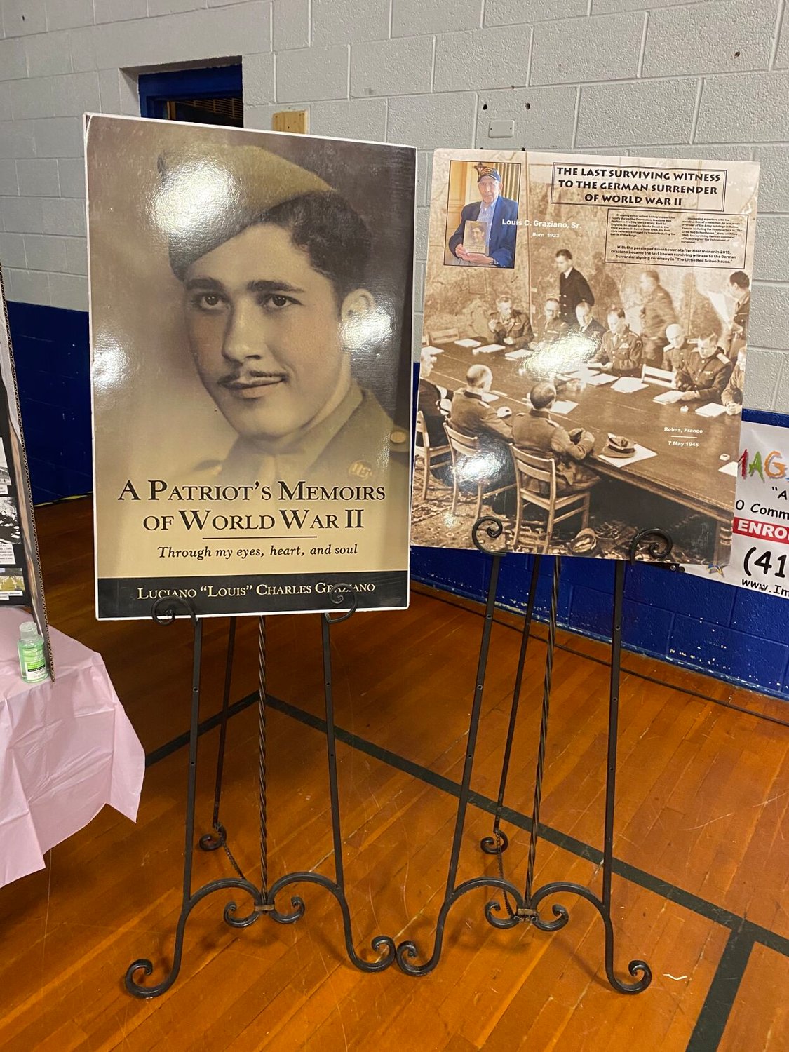 Luciano “Louis” Charles Graziano’s booth at the Nostalgia Autograph Festival had copies of the 98-year-old’s memoir available for purchase.  The WWII vet was happily taking photos and signing autographs at the festival. 