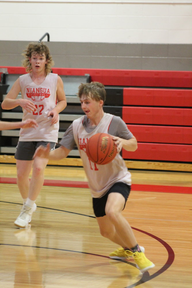 Junior Brayden Johnston works on his offensive skills while being defended by a teammate. The team this year can be said to have great team leadership. The entirety of the practice, the boys were talking and encouraging each other during the  tough full court drills.