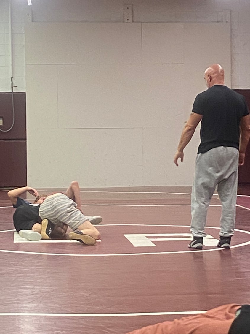 Coach Carter pictured coaching his wrestlers. Carter, while still taking the necessary precautions of Covid-19, is excited to be able to wrestle the way the boys have in previous seasons.