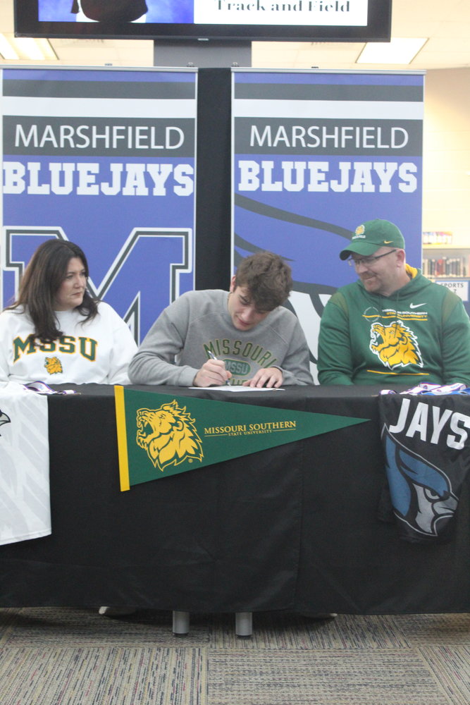 Marshfield’s Peyton McBride signs for track and field at Missouri Southern State University on Wednesday, Nov. 10. McBride will be entering his fourth year this season with the track and field team as well as the Jays basketball team.