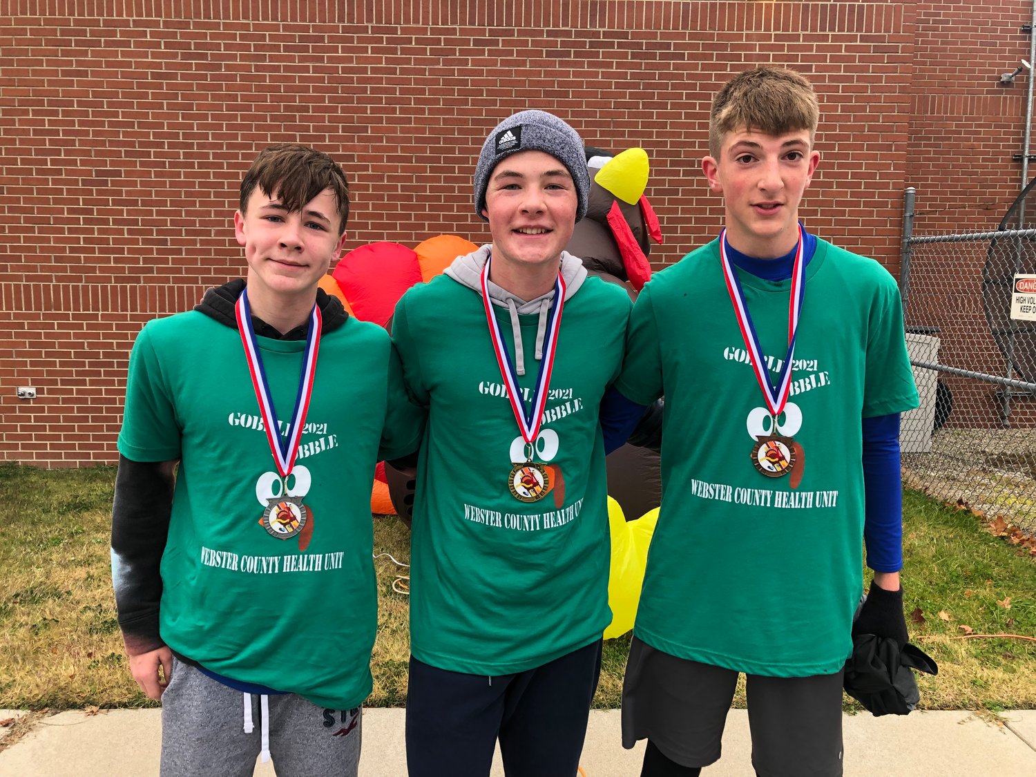 (Left to right) Jake Mitchell, 13, Zachary Mitchell, 15, and Samson Stalker, 14, finish top 3 at the 2021 Gobble Wobble.